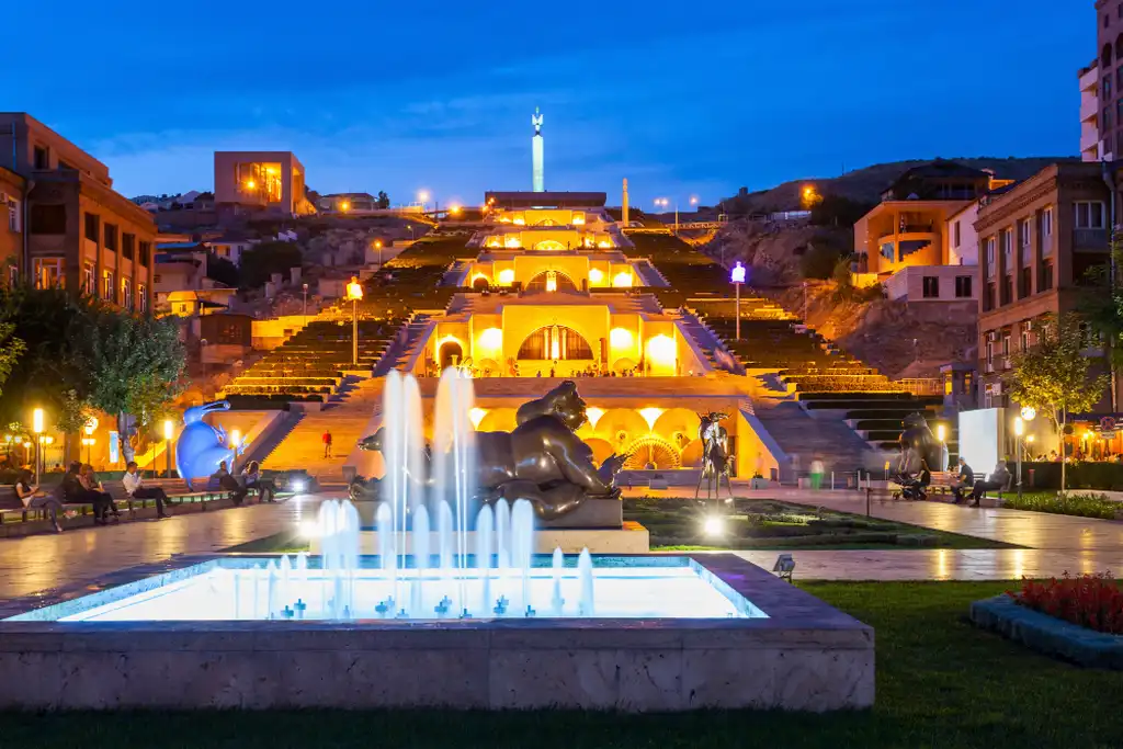 The image shows the Yerevan Waterfall at night while sightseeing in Armenia